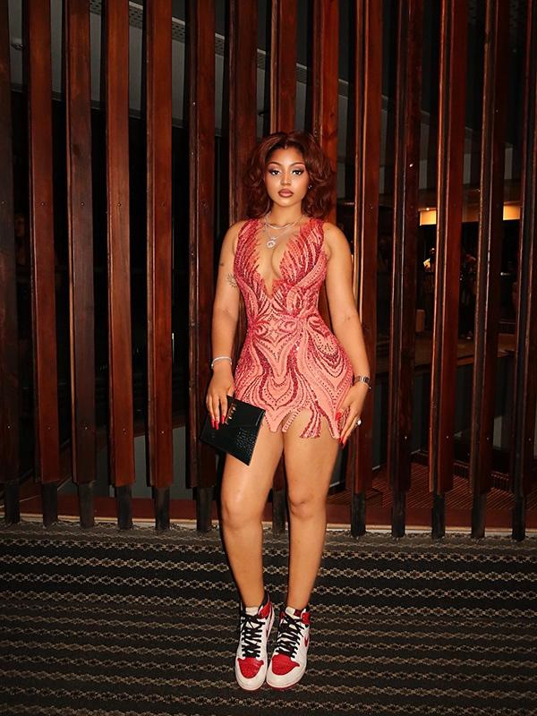Regina Daniels in Embellished Mini Dress Styled with Statement Sneakers | OutfitLibrary.com