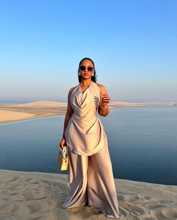 Victoria Uvo Stuns in All-White Desert Look with Cowl Neck Top & Wide-Leg Trousers | OutfitLibrary.com