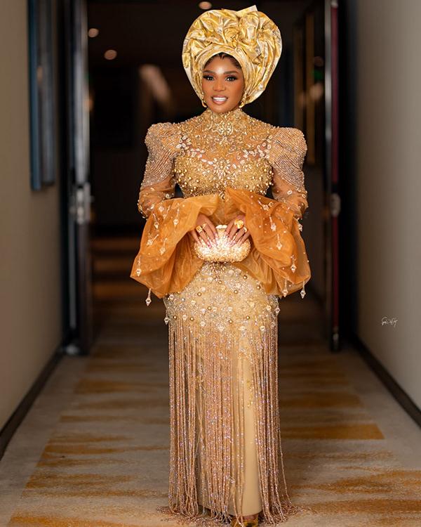 Iyabo Ojo Stuns in Gold Pearl-Embellished Fringe Aso Ebi Gown & Gele | OutfitLibrary.com