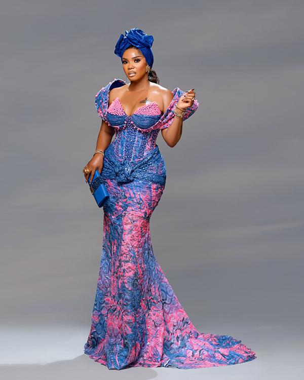 Iyabo Ojo Shines in Blue & Pink Corset Aso Ebi Gown with Structured Gele | OutfitLibrary.com