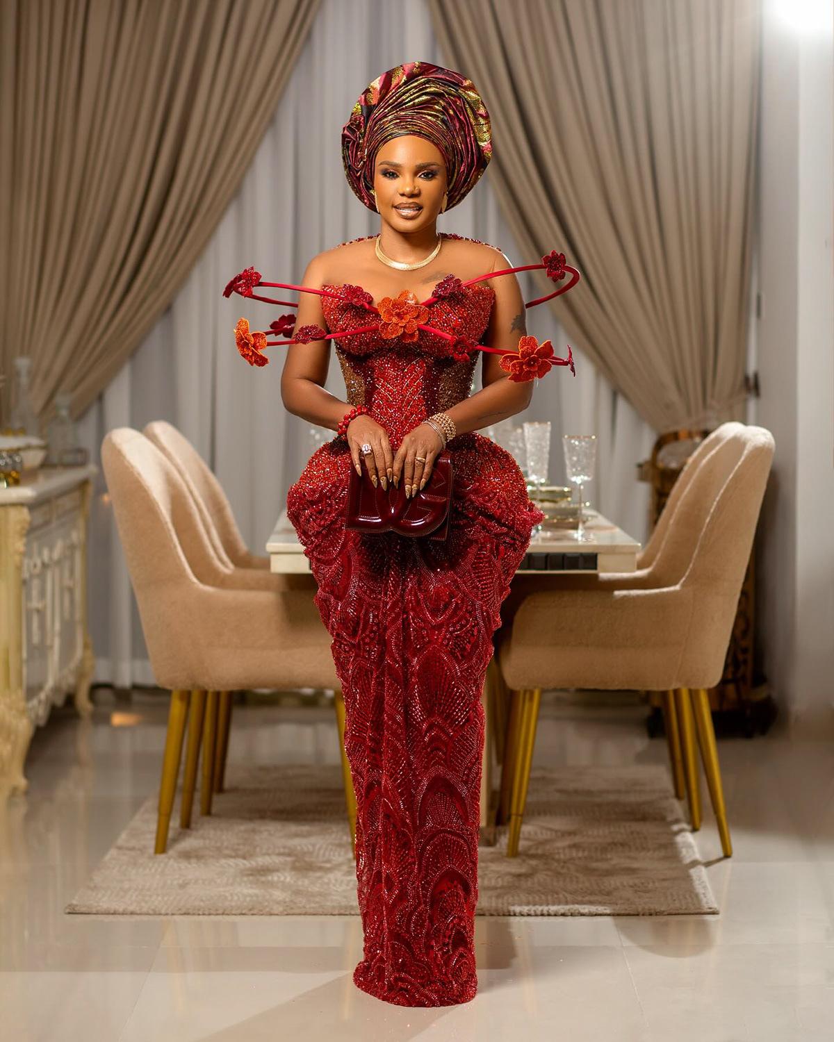 Iyabo Ojo in Red Sculptural Floral Aso Ebi Gown with Dramatic Gele | OutfitLibrary.com
